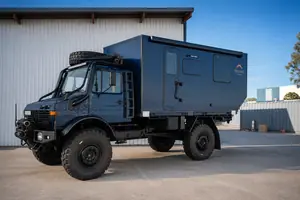 Blue Unimog Overlander Camper — view 1